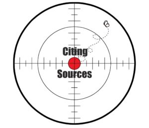 sighting target with words citing sources and a fly flying