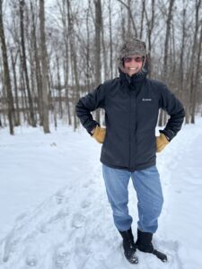 Nancy Dru hiking the trail near her house on a snow day.