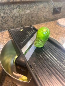 Using mandolin to slice cucumbers