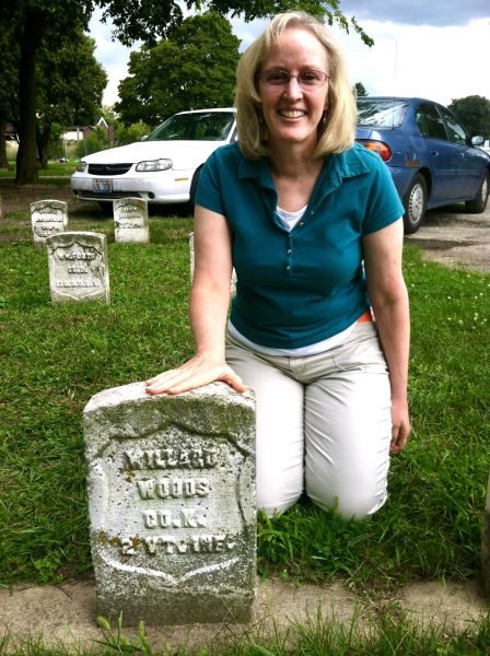 Nancy touching the headstone of her 3rd great-grandfather